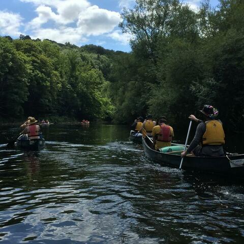 Group of people canoe the River Wye
