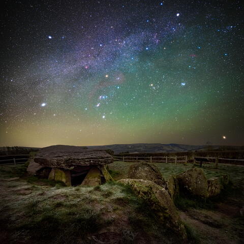 Arthurs Stone pictured at night, with a sky full of bright stars