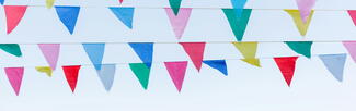 Festival bunting against a blue sky