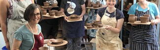 A group of people attending a pottery class at Eastnor Pottery