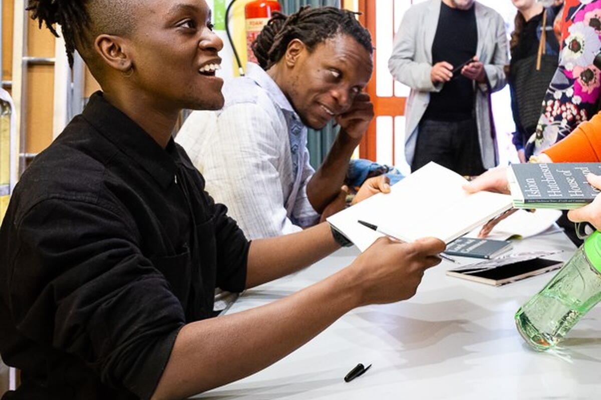 Two Authors signing books