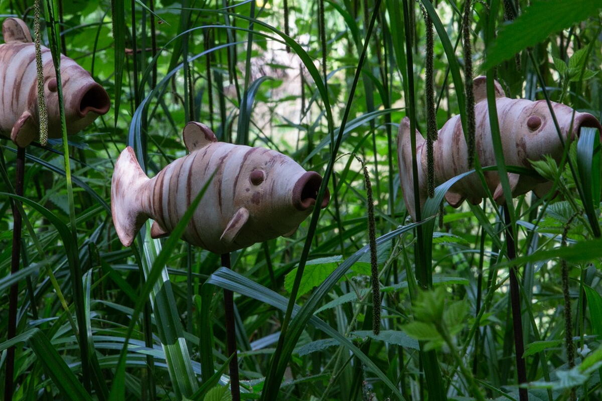 3 Fish sculptures in the long grass