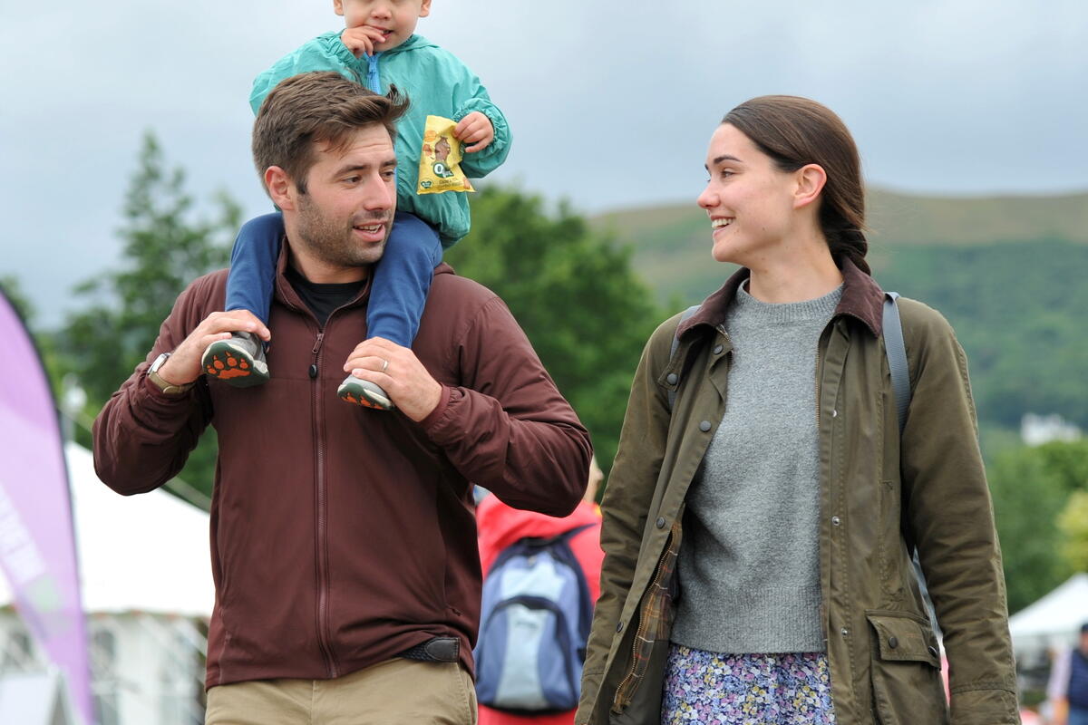 Family of three enjoying the show