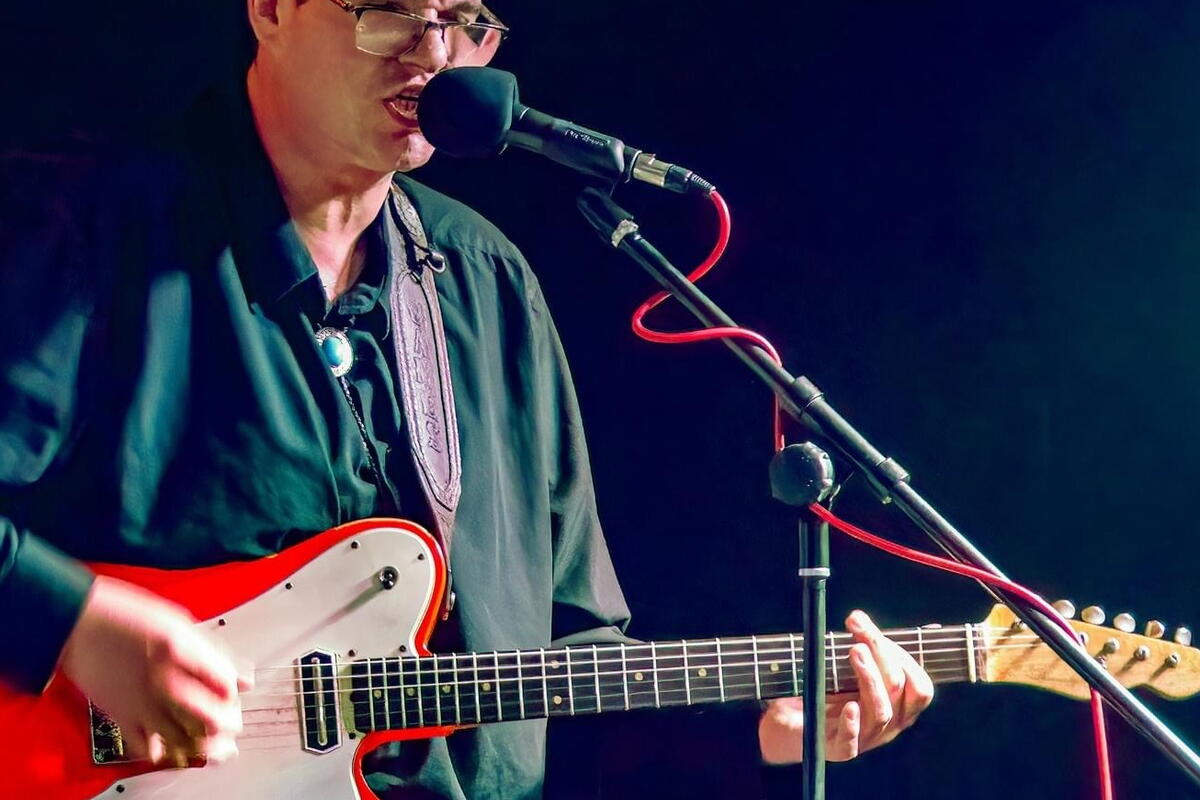 Male singer with guitar