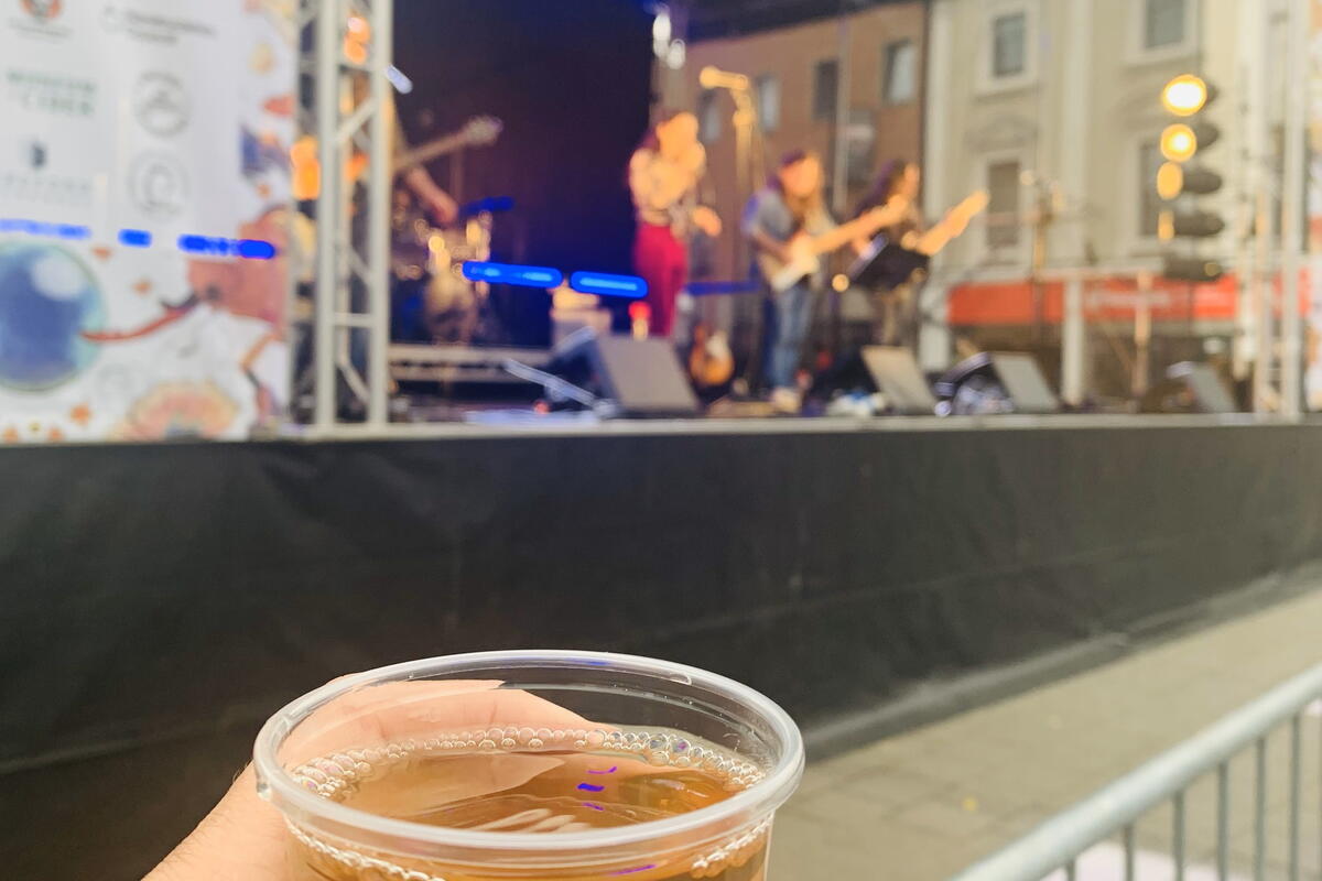 cup of cider in front of stage