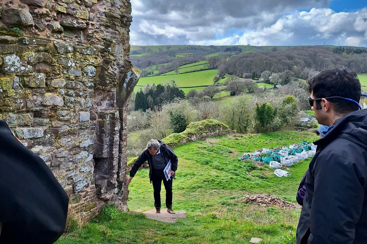 A group of people gathered outside at Snodhill Castle