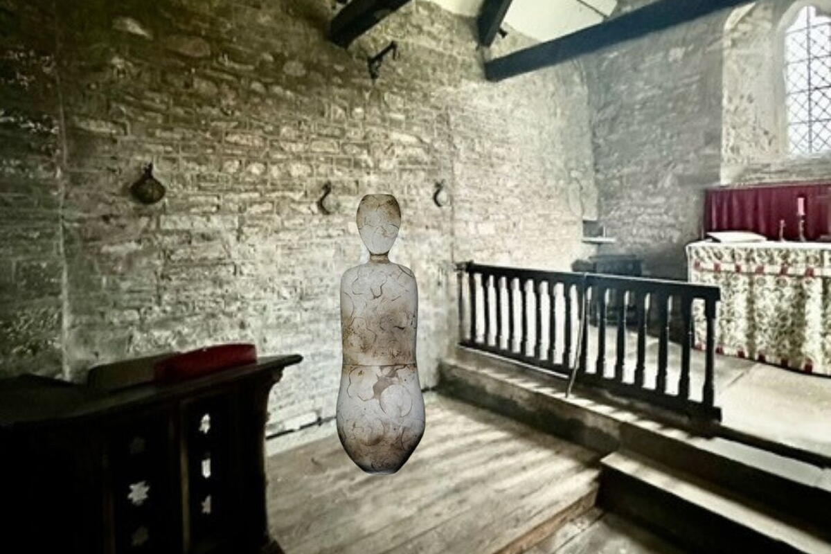 monochrome photo of glass vessel in room with exposed beams