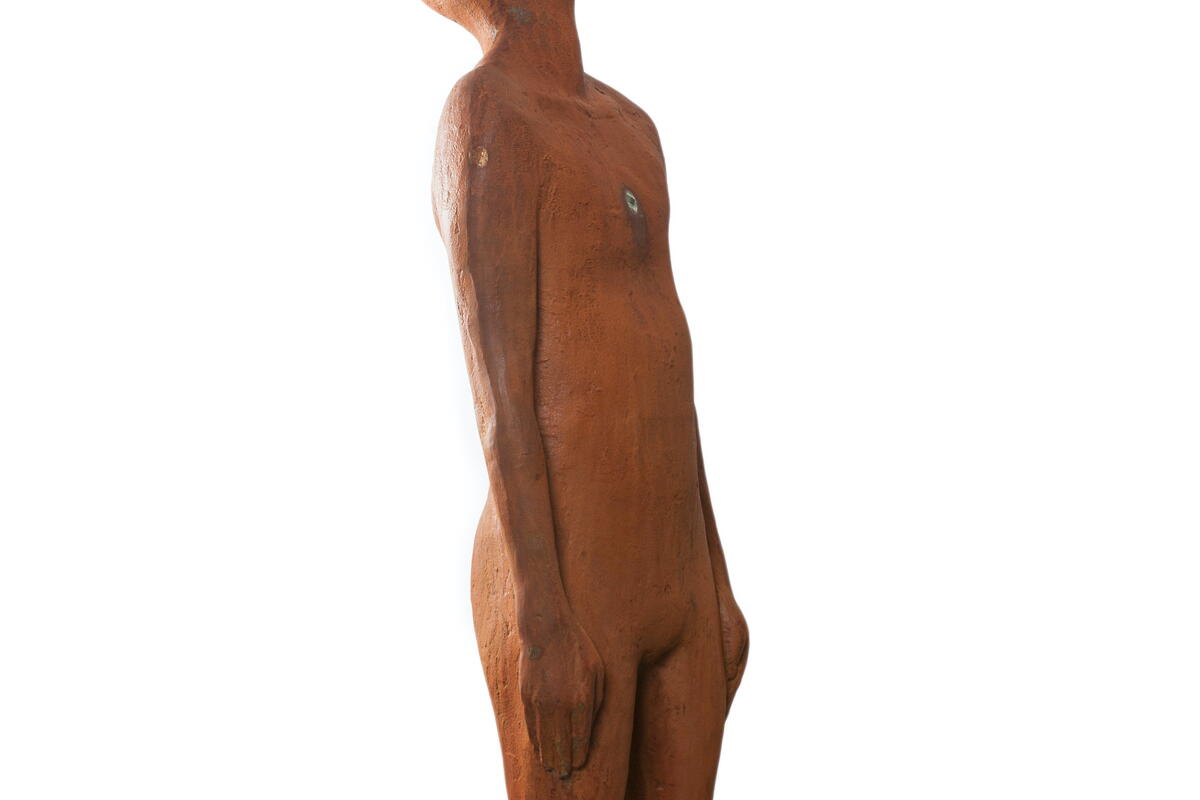 cast iron sculpture of figure