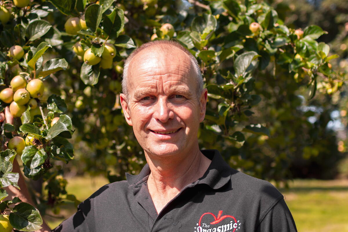 man stood in orchard