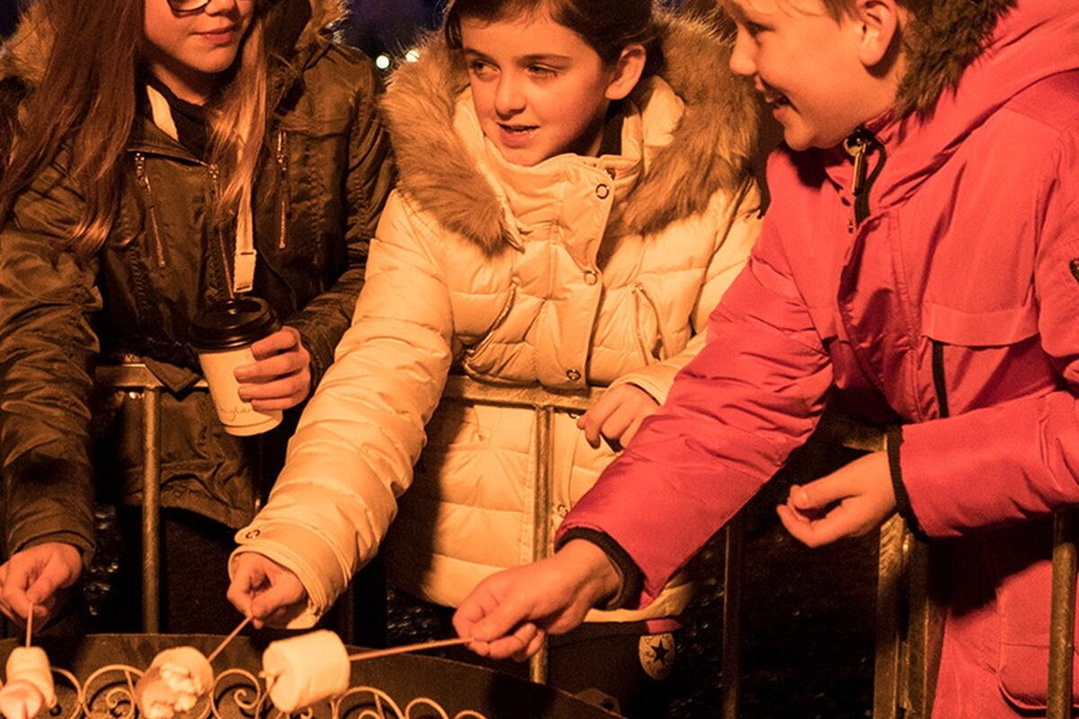 children toasting marshmallows