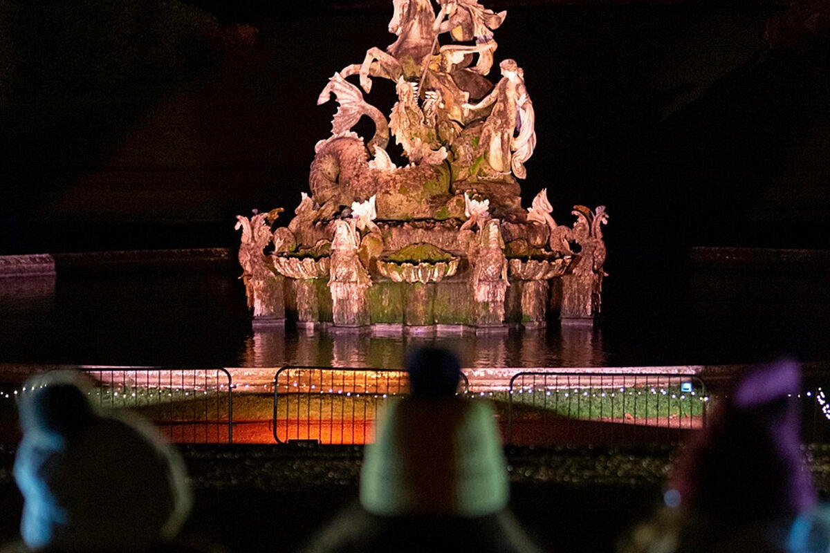 Illuminated fountain at night