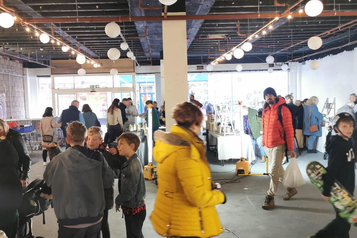 people attending a ceramics market