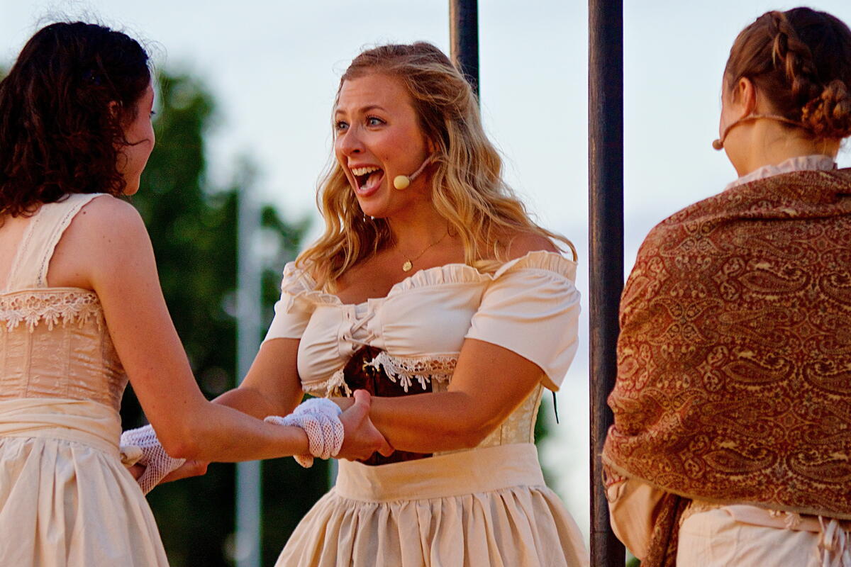 Three actors on the open air stage