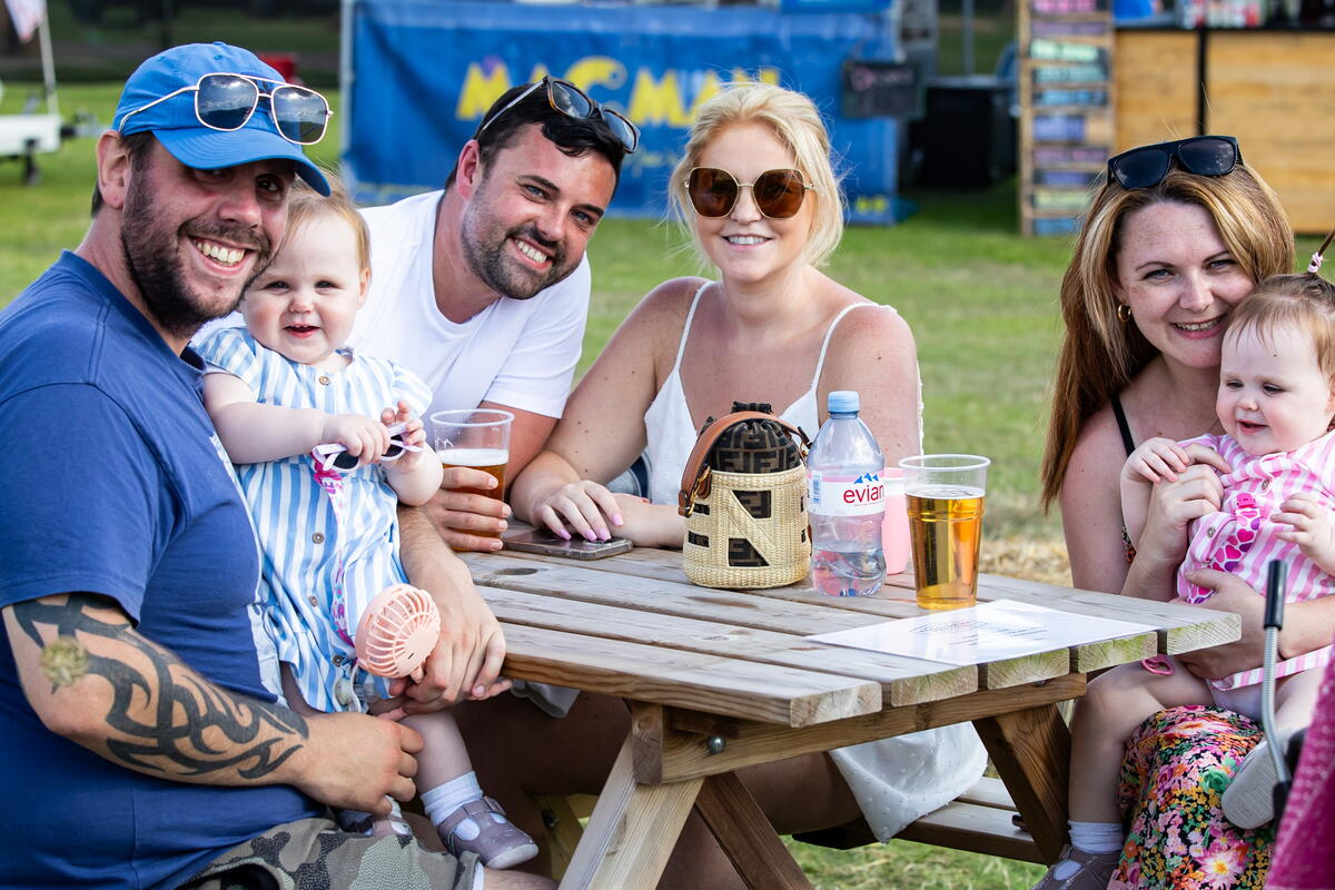 family and friends at a picnic table 