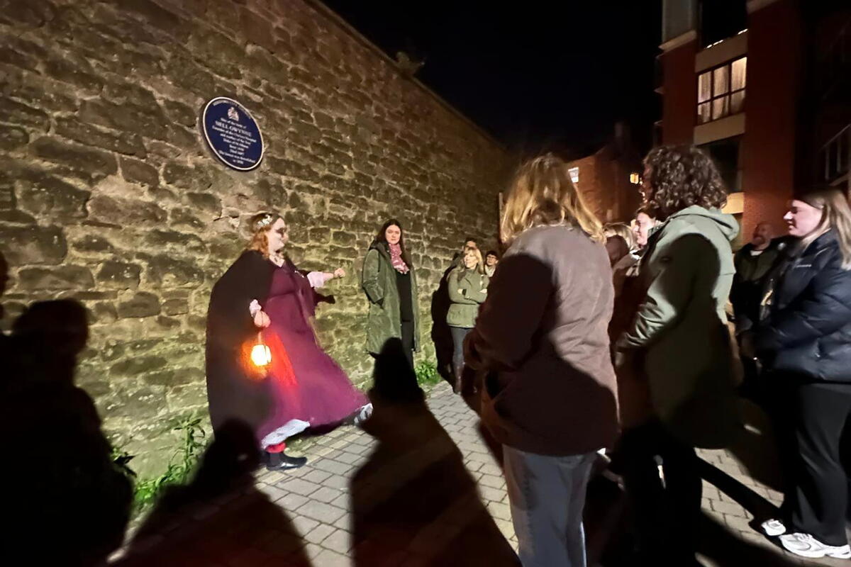 People attending a ghost tour at night