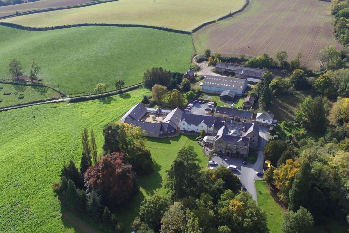 aerial photograph of large property and surrounding fields