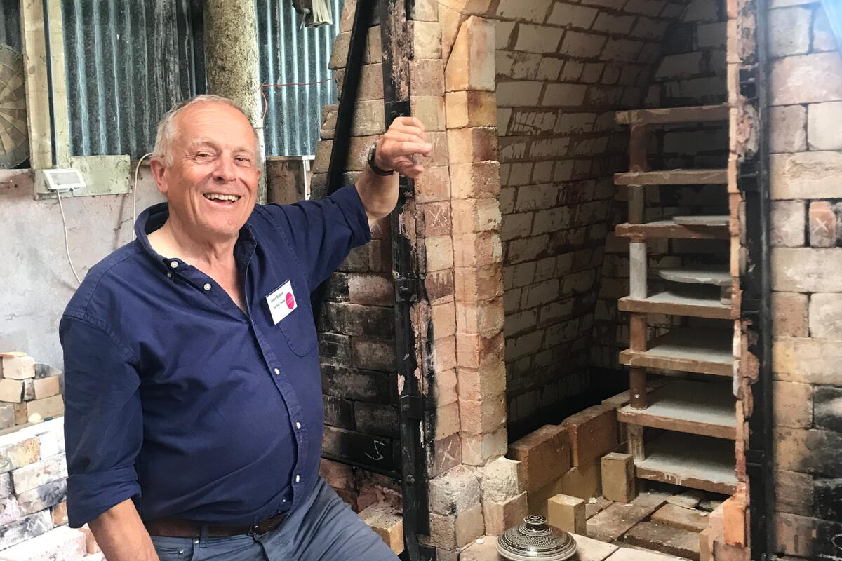 man with brick kiln oven