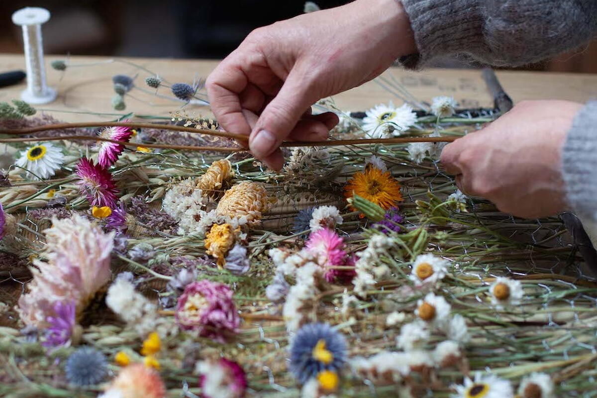 Person making a flower panel