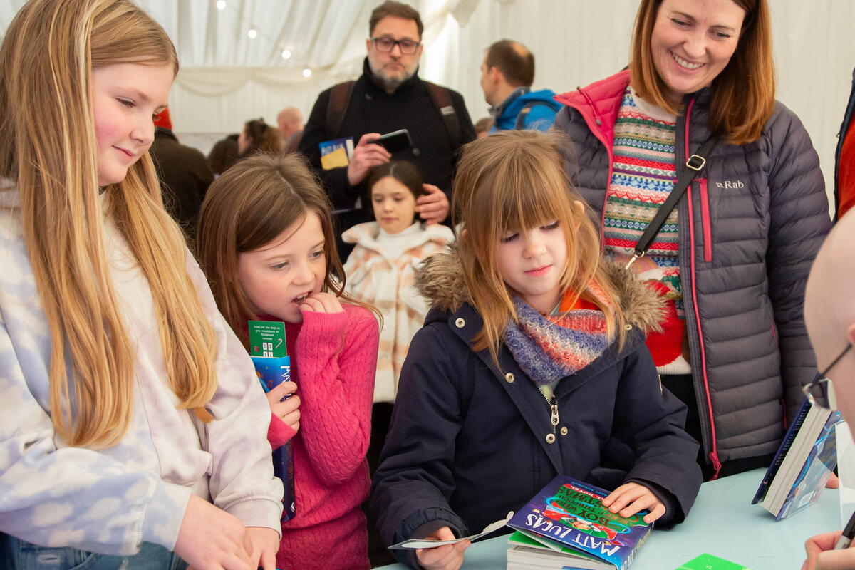 children getting books signed