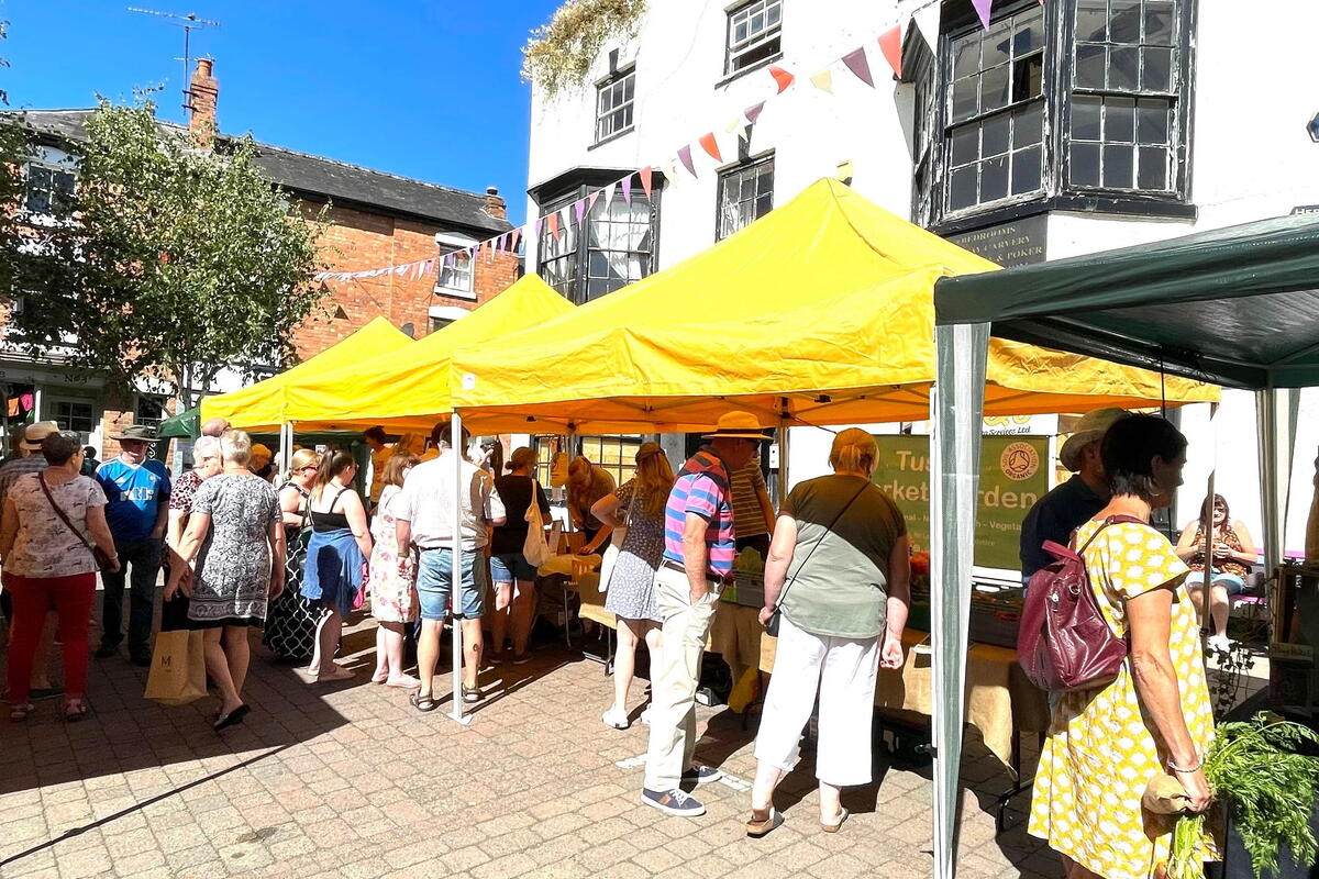 Market square with stalls and shoppers