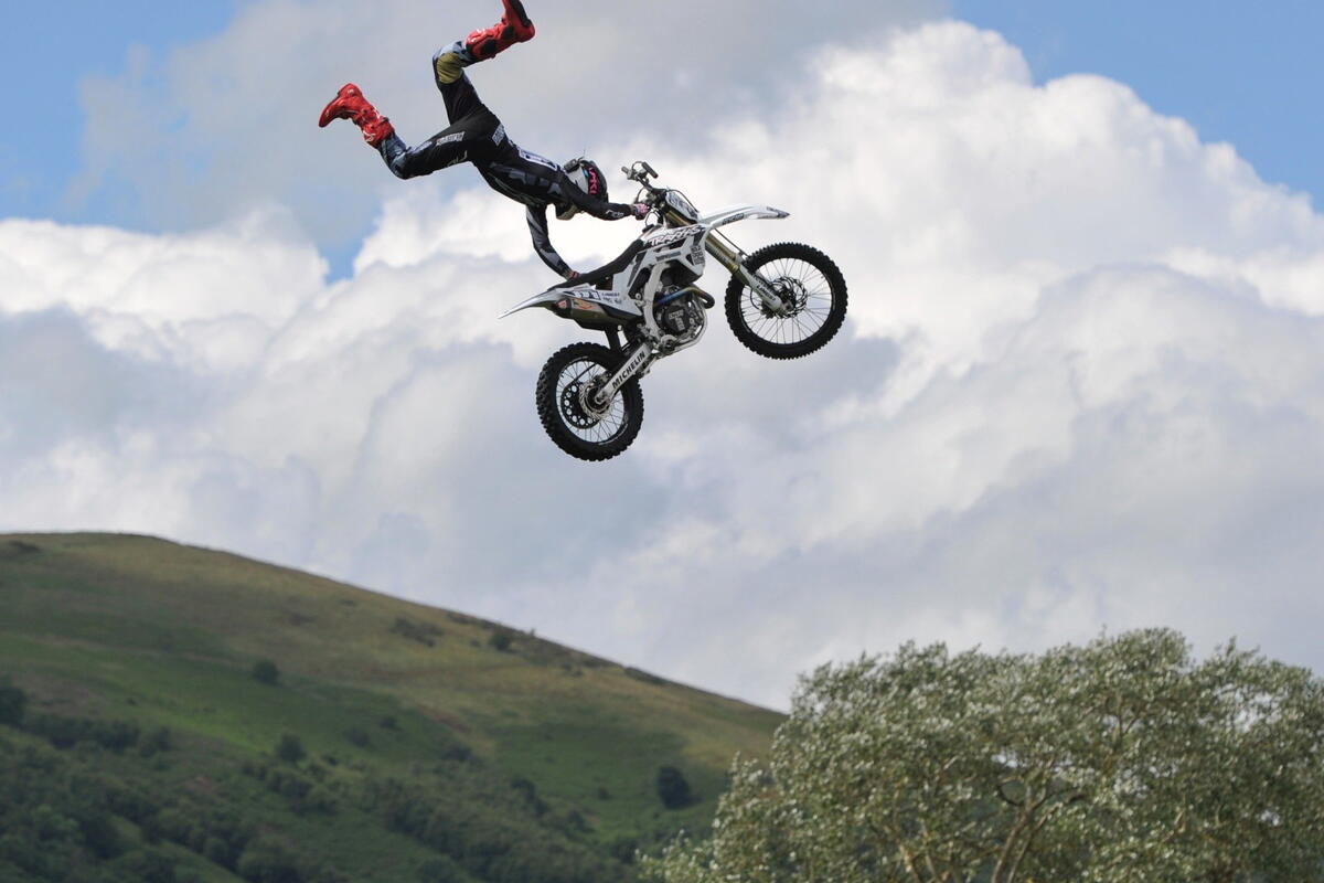 stunt biker rider performing trick