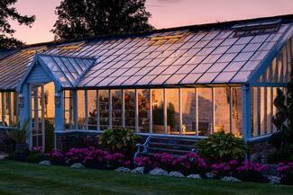 Glass house at sunset
