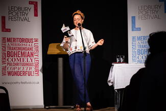 poet performing on stage