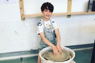 Boy at Potter's wheel