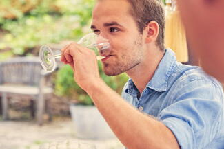 Young man tasting wine at Frome valley