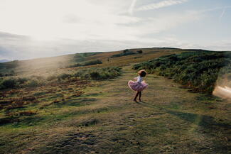 Girl running free on Garway Hill