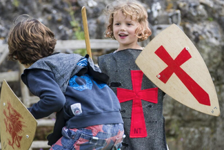 Kids playing medieval dress up 