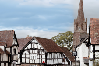 Quaint Herefordshire village scene with houses and a church