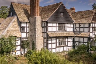 black and white tudor era farm house