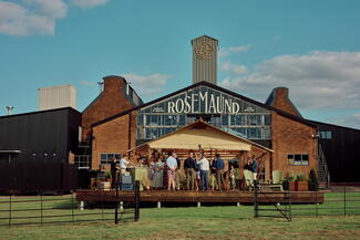 View of a party gathering outside Rosemaund Distillery
