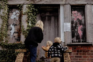 Young family explore half-timbered house