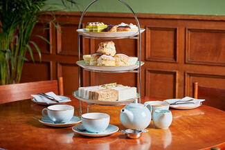 Afternoon tea, including cakes on a table at the Green Dragon Hotel