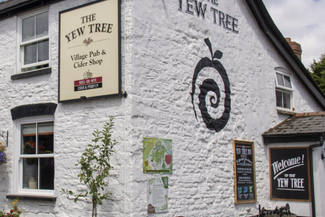 traditional country pub with blue sky background 