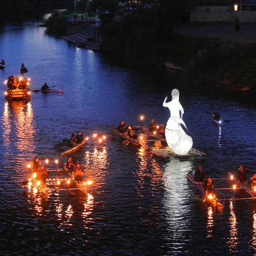 Illuminated craft float down the Wye