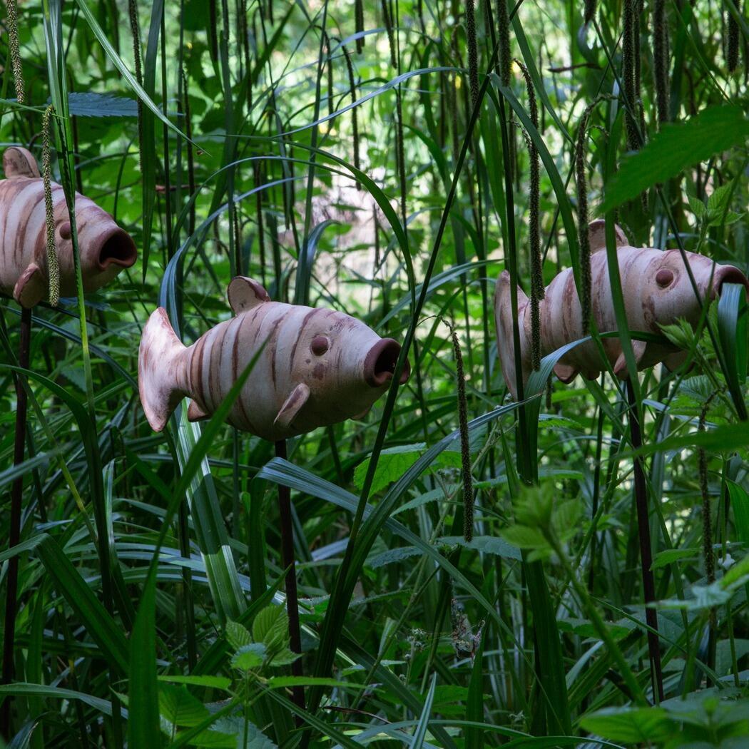 3 Fish sculptures in the long grass