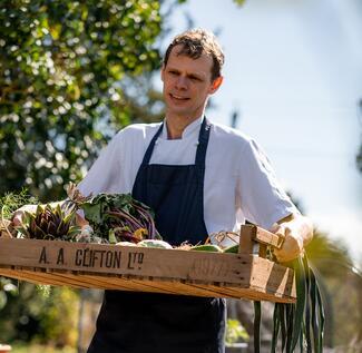 Pensons head chef Chris Simpson collecting produce from the kitchen garden