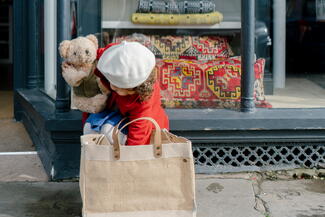 Girl with Shopping bag outside shop