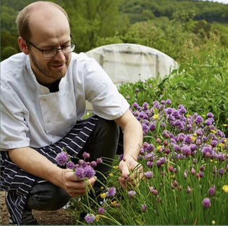 Chef Andy Link picking chives