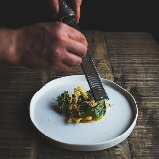 Lemon zest being grated over food