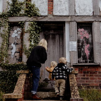 Young family explore half-timbered house