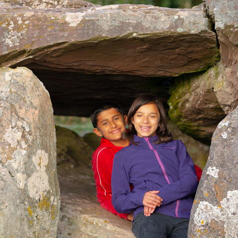 Children playing underneath Arthur's Stone