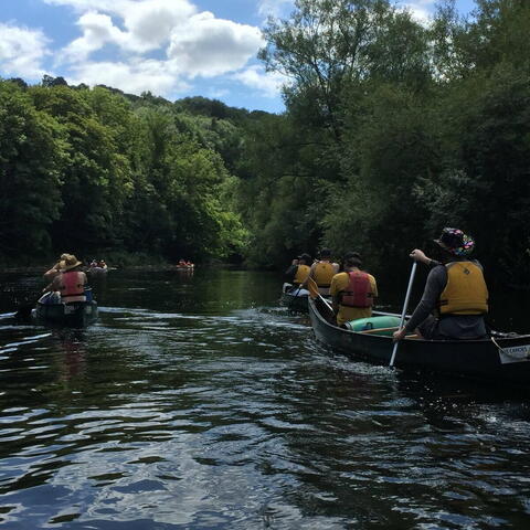 Group of people canoe the River Wye