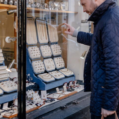 Man looking into jewelry shop