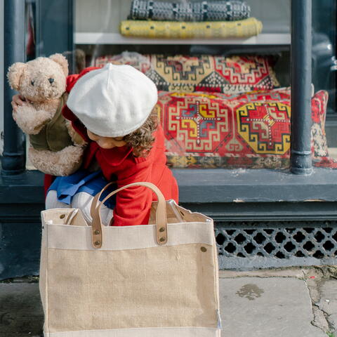 Girl with Shopping bag outside shop