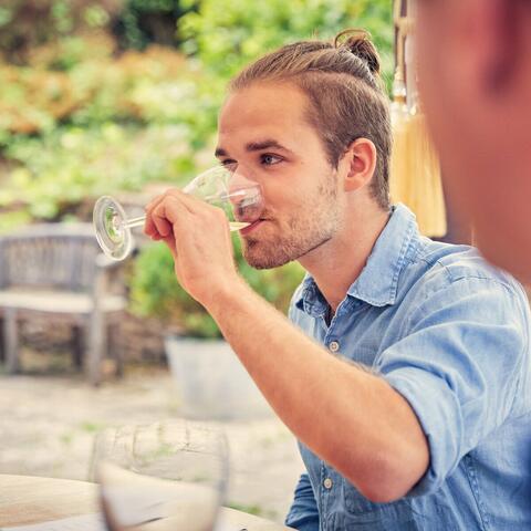 Young man tasting wine at Frome valley