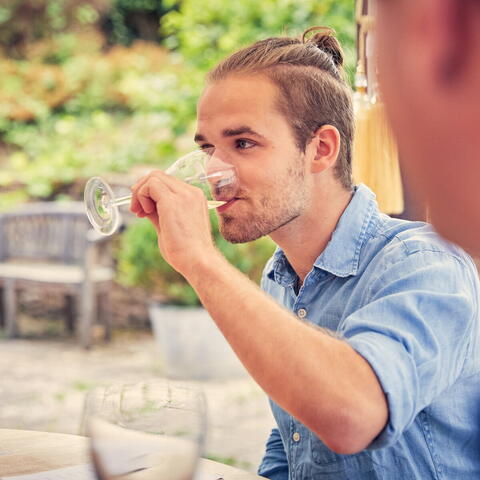 Young man tasting wine at Frome valley